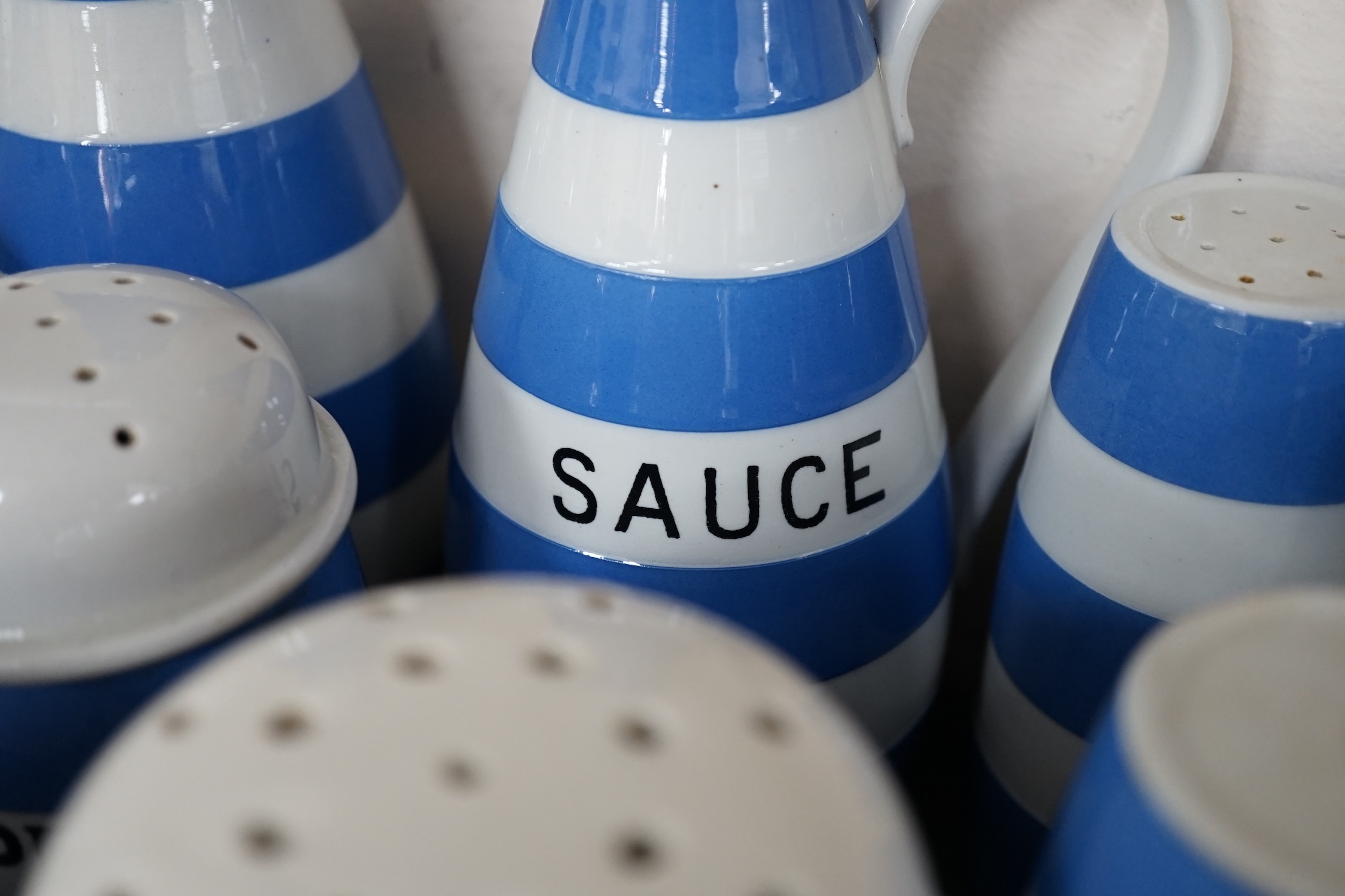 T.G.Green Cornish Kitchenware, a collection to include eleven flour, sugar, salt, brown flour and pepper shakers, six lidded jars, oil and sauce bottles, egg cruet etc, approximately thirty pieces, mixed marks. Condition